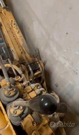 retroescavatore con kit pompa in ghisa 