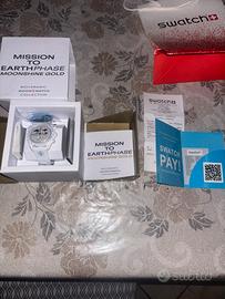 omega x swatch mission to the earthphase gold