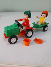 Playmobil bambini con trattore e rimorchio