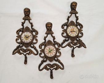 Tris ganci appendiabiti in ottone