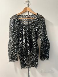 Blusa trasparente a pois