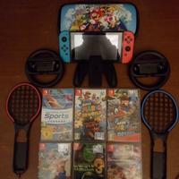 Nintendo switch + 6 giochi, volanti e racchette 
