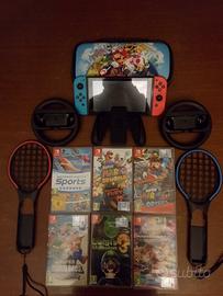 Nintendo switch + 6 giochi, volanti e racchette 