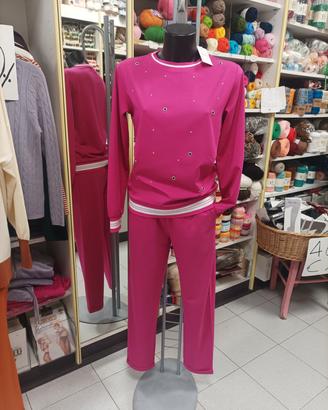 Tuta fucsia marca oro blu