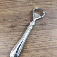 Apri bottiglia vintage in metallo. 