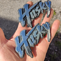 Logo Husky fender trim emblema