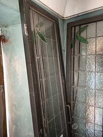 PORTA A DOPPIA ANTE IN FERRO E VETRO