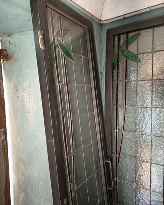 PORTA A DOPPIA ANTE IN FERRO E VETRO