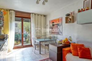 BILOCALE CON GIARDINO PRIVATO E POSTO AUTO COPERTO