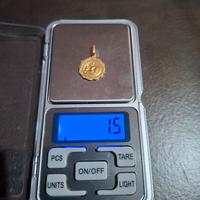 CIONDOLO DI ORO 750 PESO 1,50 GRAMMI