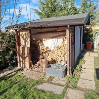 Casetta attrezzi con legnaia