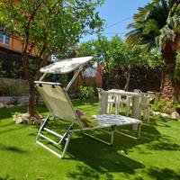 Appartamento con tre camere e giardino