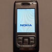 telefono cellulare Nokia E 65 con carica batterie 