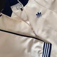 Giacca unisex con zip laterale a righe co-branded