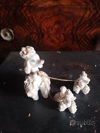 tris cani barboncini in porcellana bianca