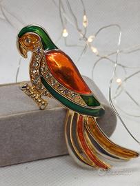 spilla pappagallo L'Oréal 