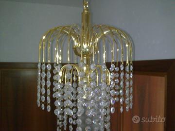 Coppia di lampadari a pioggia bagnati in oro