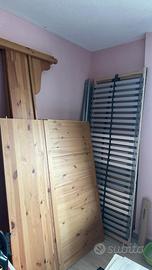 Letto in legno con rete e materasso