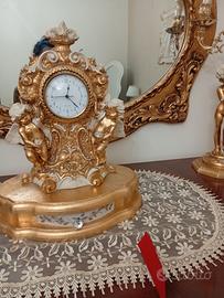 candelabri e orologio , e due lumi 