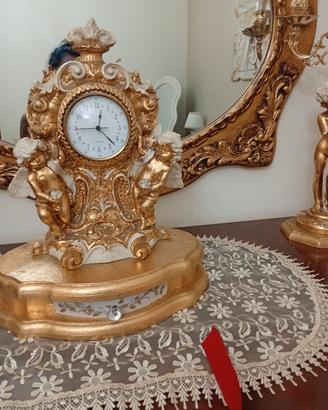 candelabri e orologio , e due lumi 