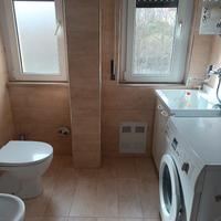 Trilocale due camere, soggiorno con angolo cottura