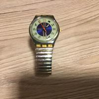 Orologio Swatch con cinturino elastico oro