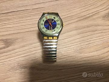 Orologio Swatch con cinturino elastico oro