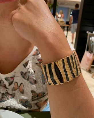 Bracciale a fascia dorato e nero. Nuovo 
