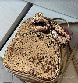 Zainetto paillettes champagne
