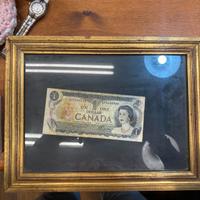 Quadretto con banconota un dollaro canadese