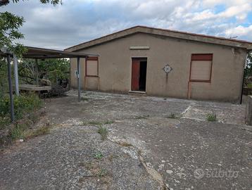 Terreno con casa