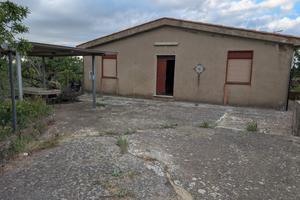 Terreno con casa
