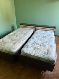 Letto singolo con ampia spalliera cassapanca
