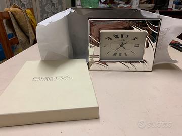 Orologio con cornice argento