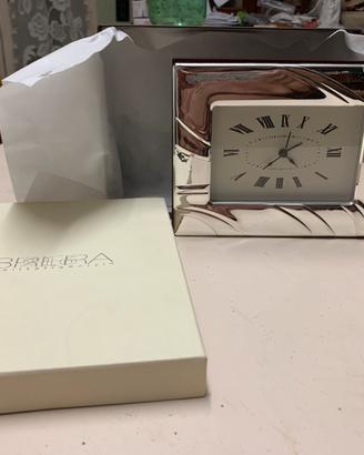 Orologio con cornice argento