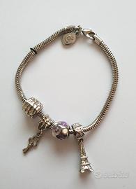 Braccialetto con 4 charmes e due fermi in acciaio