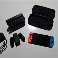 Nintendo Switch rossa e nera + accessori +3 giochi