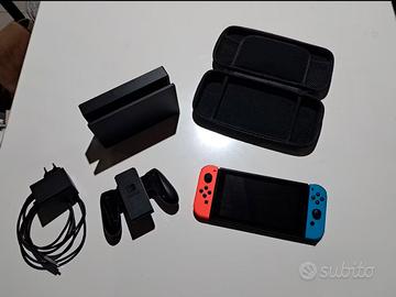 Nintendo Switch rossa e nera + accessori +3 giochi