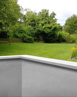 Coprimuro in cemento levigato