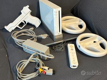 Wii console con 1 telecomando e accessori in foto