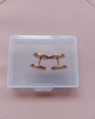 Orecchini piercing di colore dorato