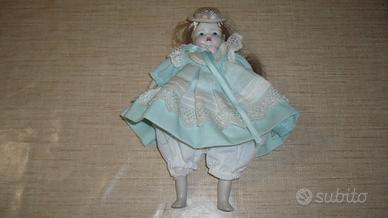 Bambola vintage da collezione con viso in ceramica