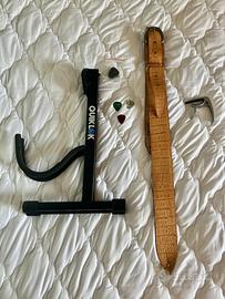 Accessori chitarra: custodia, sostegno, …