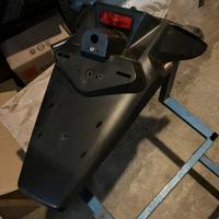 Porta targa origina parafango posteriore Xmax 250