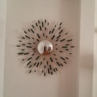 Specchio sole acciaio e pietre dure