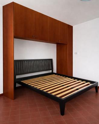 Camera com armadio a ponte ideale per monolocali