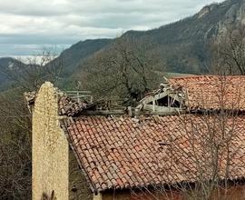 Terreno con annesso rustico in pietra coke