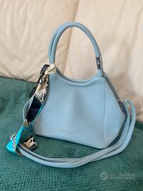 Borsa sweet years azzurro pastello con fiocchetto.