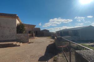 Caseggiato con terreno