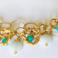 bracciale a catena color oro, con pietre